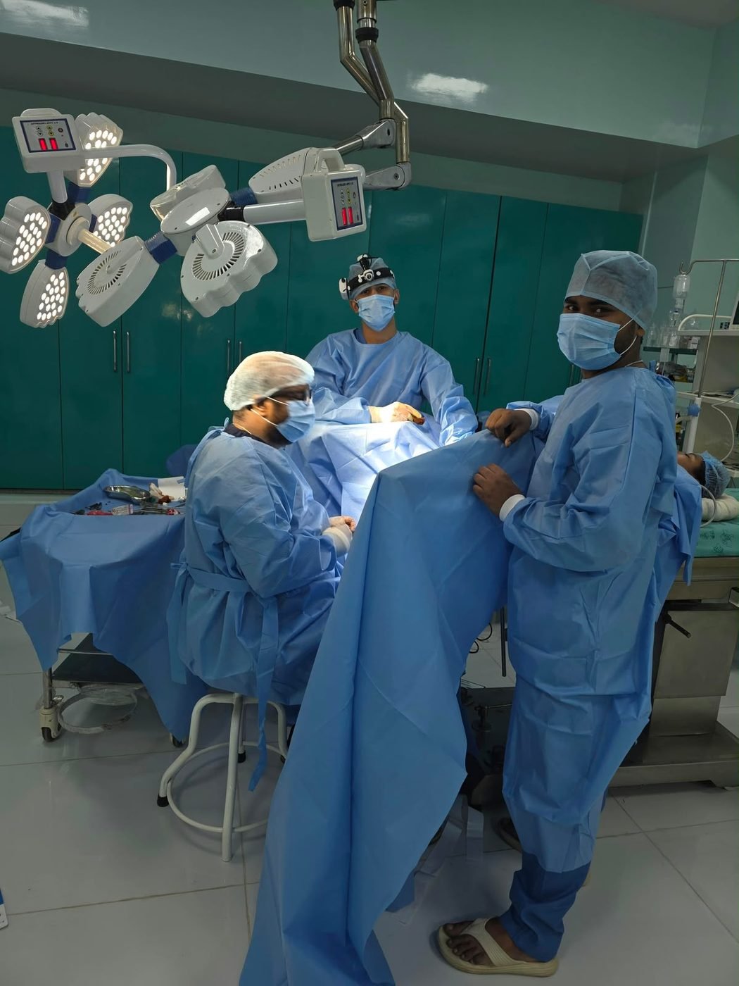 Surgical team at work under the operating lights