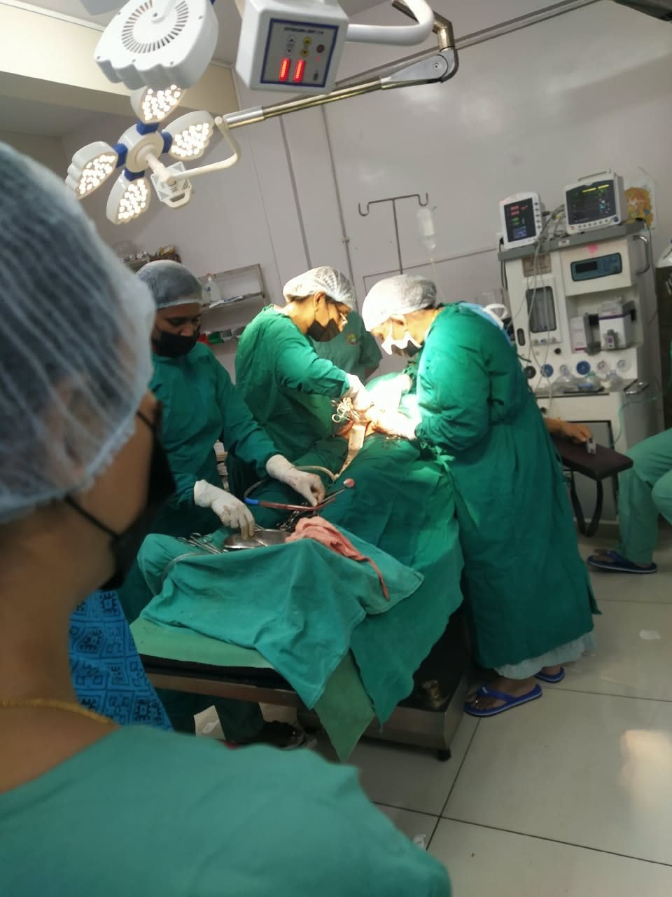 Obstetric team performing a caesarean section